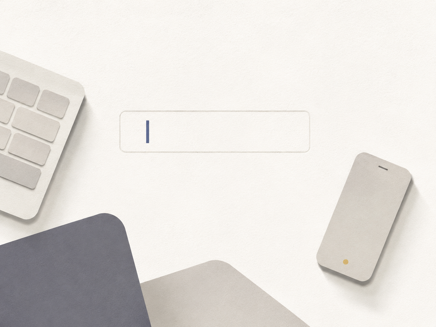 A desk workspace: hands resting on a keyboard in front of a monitor, a phone within reach.